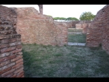 00617 ostia - regio v - insula xii - tabernae der horrea (v,xii,2) - bli von der suedseite ri norden - taberna vi - dritter raum ri decumanus maximus - 09-2022.jpg